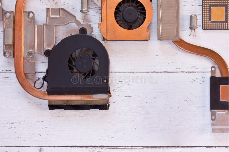 Close up view of cooling system of computer processor on white wooden background. Electronic board with heatpipe and radiators,mic. Roprocessor,transistors. Flat royalty free stock photos