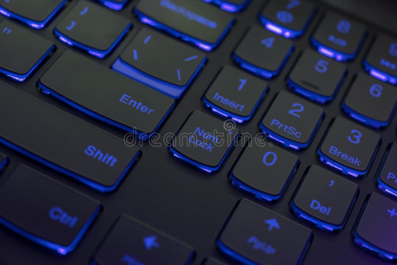 Colorful keyboard for gaming. Backlit keyboard with blue color scheme. Colorful light keyboard.  stock photo