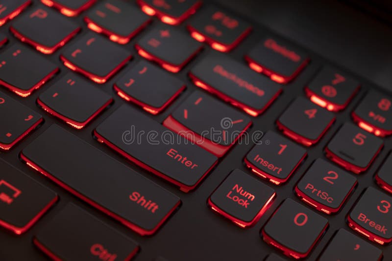 Colorful keyboard for gaming. Backlit keyboard with red color scheme. Colorful light keyboard.  royalty free stock photography