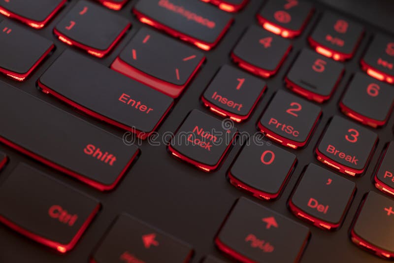 Colorful keyboard for gaming. Backlit keyboard with red color scheme. Colorful light keyboard.  stock image
