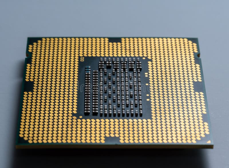 Computer chip processor without legs with microcircuits. In macro stock photography