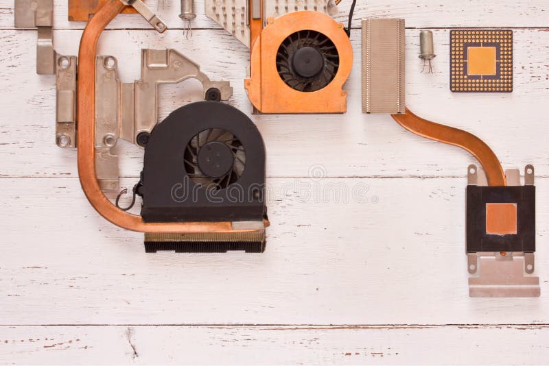 Cooling system of computer on white wooden planks.Heatpipe and radiators,microprocessor,transistors. Electronic board stock photography