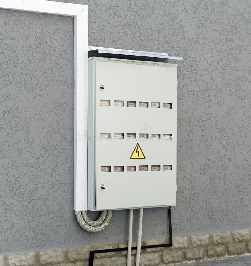 Electric shield with electric meters. On the wall of the house royalty free stock photo