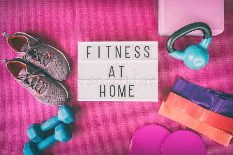 Fitness at home sign with pink yoga mat, running shoes, kettlebell weight and dumbells resistance bands and sliders for. Pilates online class. Exercise indoors stock image