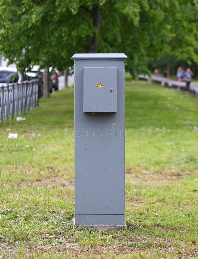 Grey electric shield on green lawn. A grey electric shield on green lawn royalty free stock photos