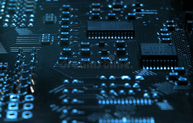 High-tech electronic board PCB with processor, microcircuits and luminous digital electronic signals. Close up macro photography stock image