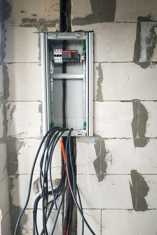 Installation of an electric new shield in a private house on the wall. 2019 stock image