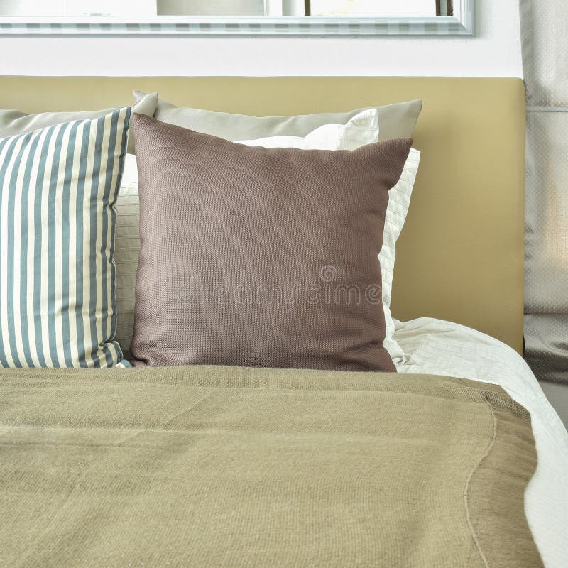 Light brown color scheme bedding with light brown headboard. And table lamp royalty free stock image