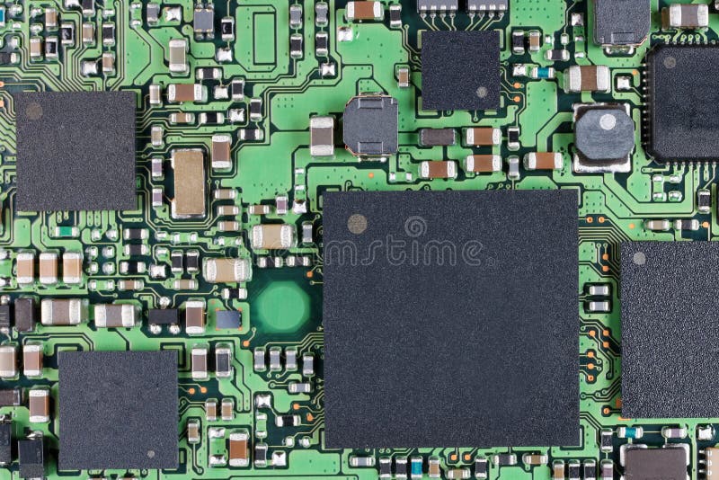Microchips and microcircuits with ball pins are installed on a m. Odern electronic circuit board. SUper macro studio concept royalty free stock photo