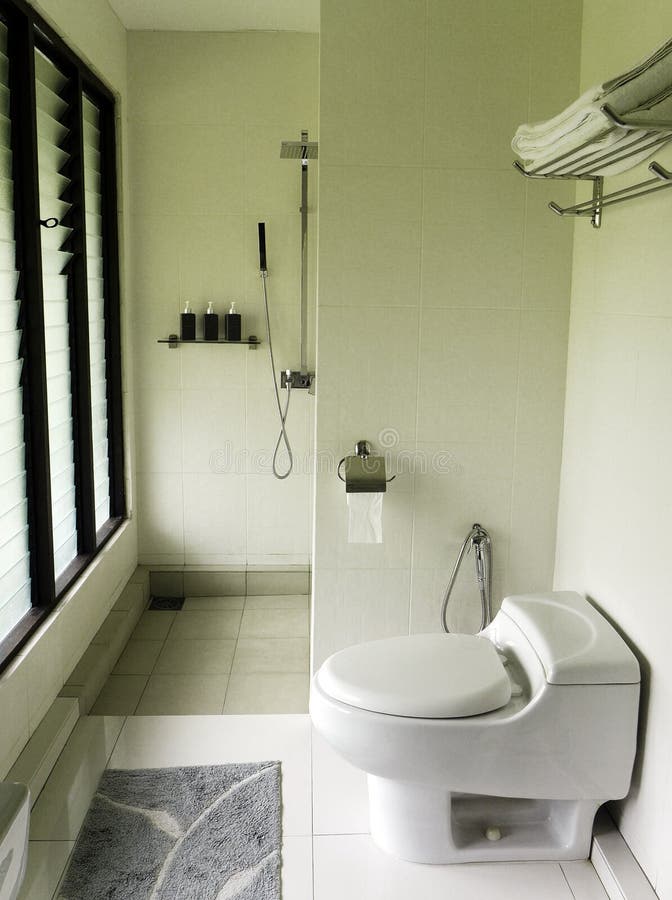 Modern elegant bathroom, natural lighting. A photograph showing the interior of a modern style bathroom in soft light, lit from diffused natural day light from royalty free stock photography
