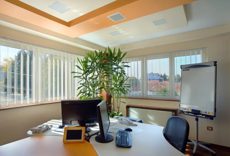 Office interior. Interior of an office, modern and simple furniture and lighting equipment stock photography