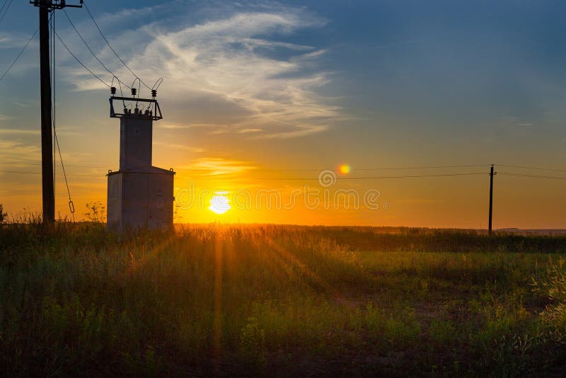 Old electric shield, high voltage switch in the field at sunset. Russia royalty free stock photography