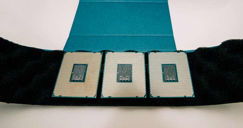 Three new powerful CPU Intel Xeon workstation. Above view of three new powerful new E5-2687W Intel Xeon professional CPU processor Broadwell FCLGA2011-3 unboxing royalty free stock photo