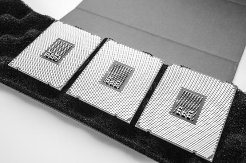 Three new powerful CPU Intel Xeon workstation unboxing unpacking. Above view of three new powerful new professional CPU processor unboxing unpacking new device stock photo