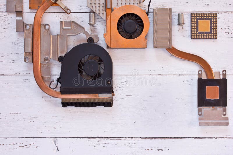 Top view of cooling system of computer processor on white wooden background. Electronic board with heatpipe and radiators,micropro. Cessor,transistors. Flat lay stock photo