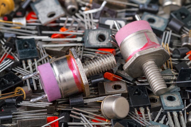 Two powerful transistors on the background of radio elements. View from above royalty free stock images