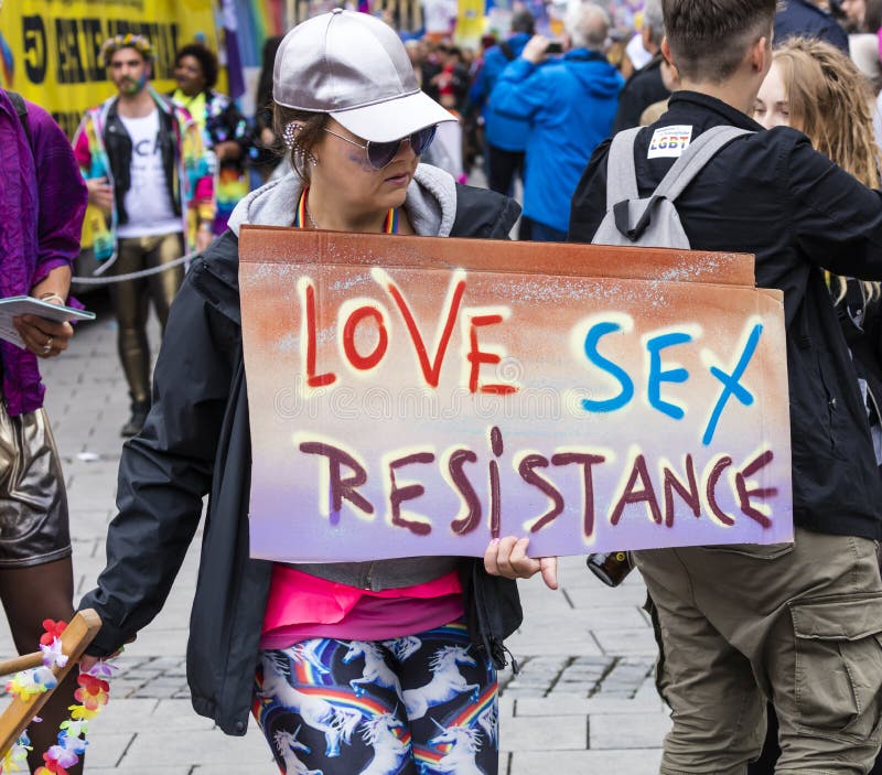 2019: Woman holding a sign `Love, Sex, resistance` attending the Gay Pride parade also known as Christopher Street DayCSD,Munich. 2019: Woman holding a sign ` royalty free stock images